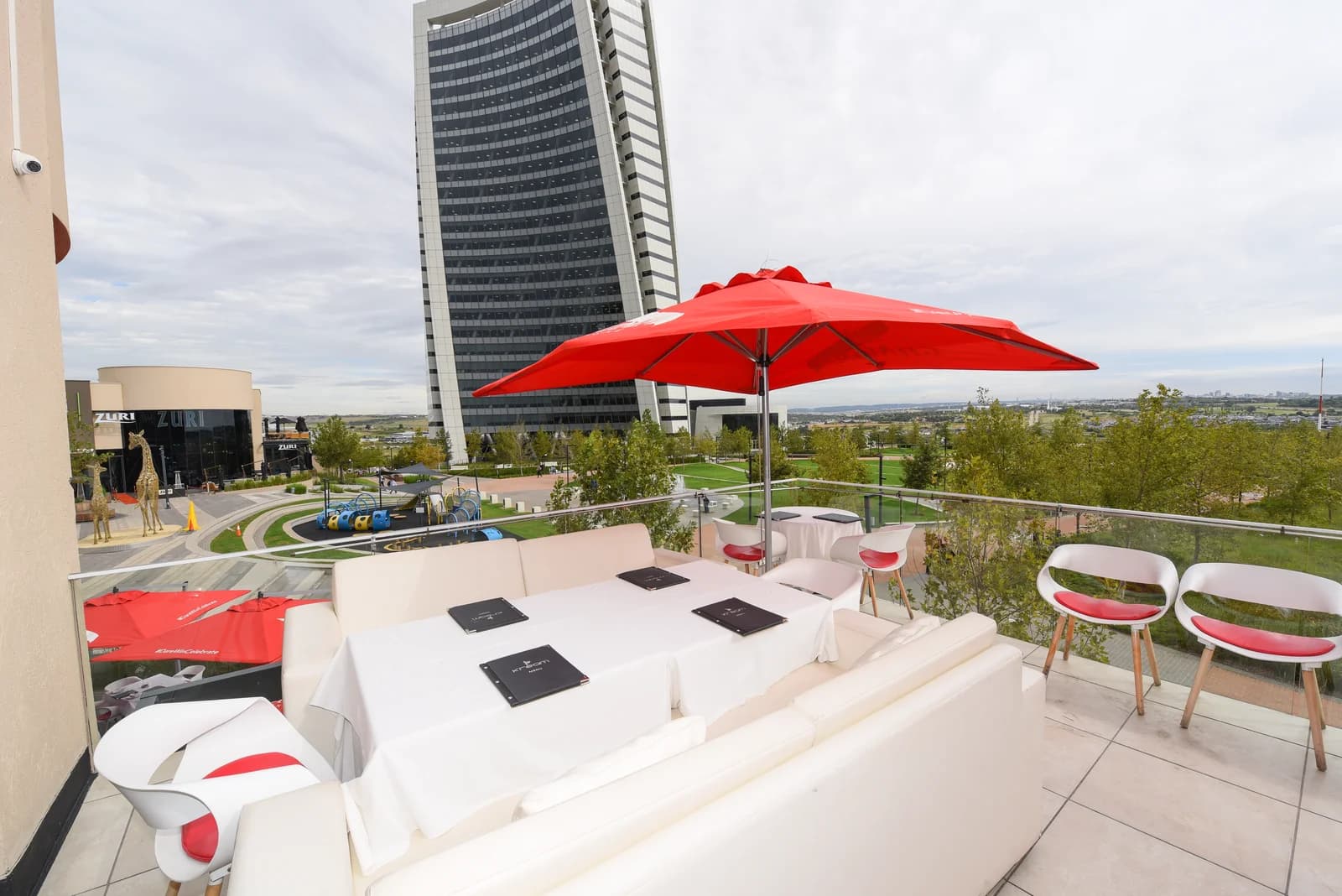 Standard 10.5 ft Square Center-Pole Umbrella in an installed outdoor setting