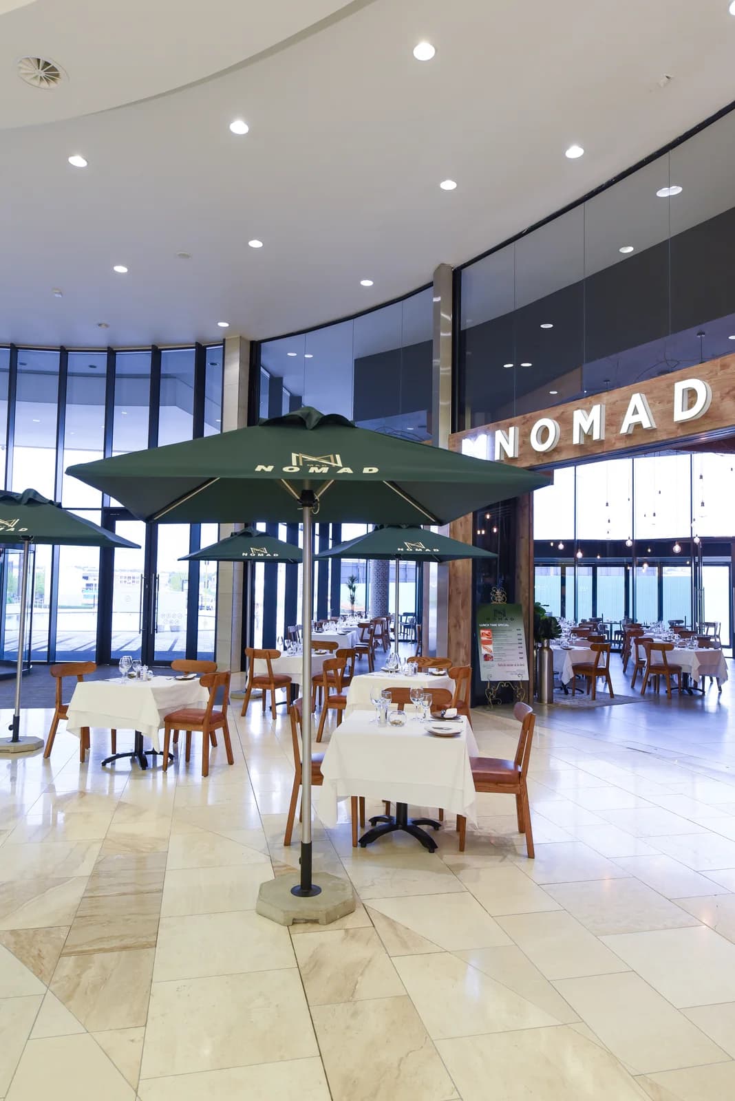 Standard 6.5 ft Square Center-Pole Umbrella in an installed outdoor setting